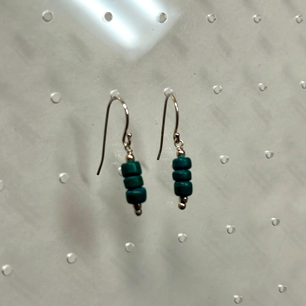 Sterling silver French hook wire earrings with green coral beads.